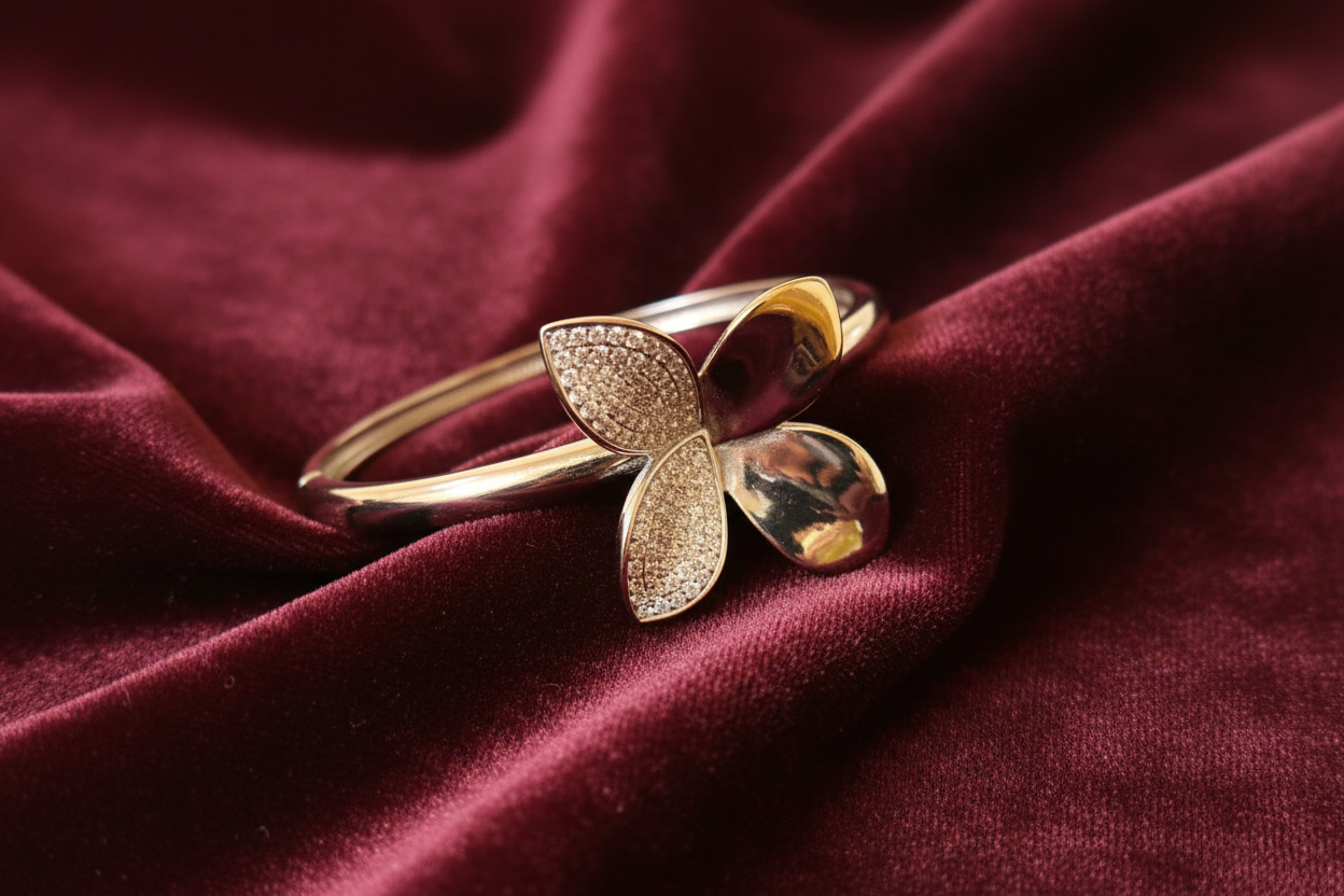Silver butterfly bracelet on burgundy velvet – front view